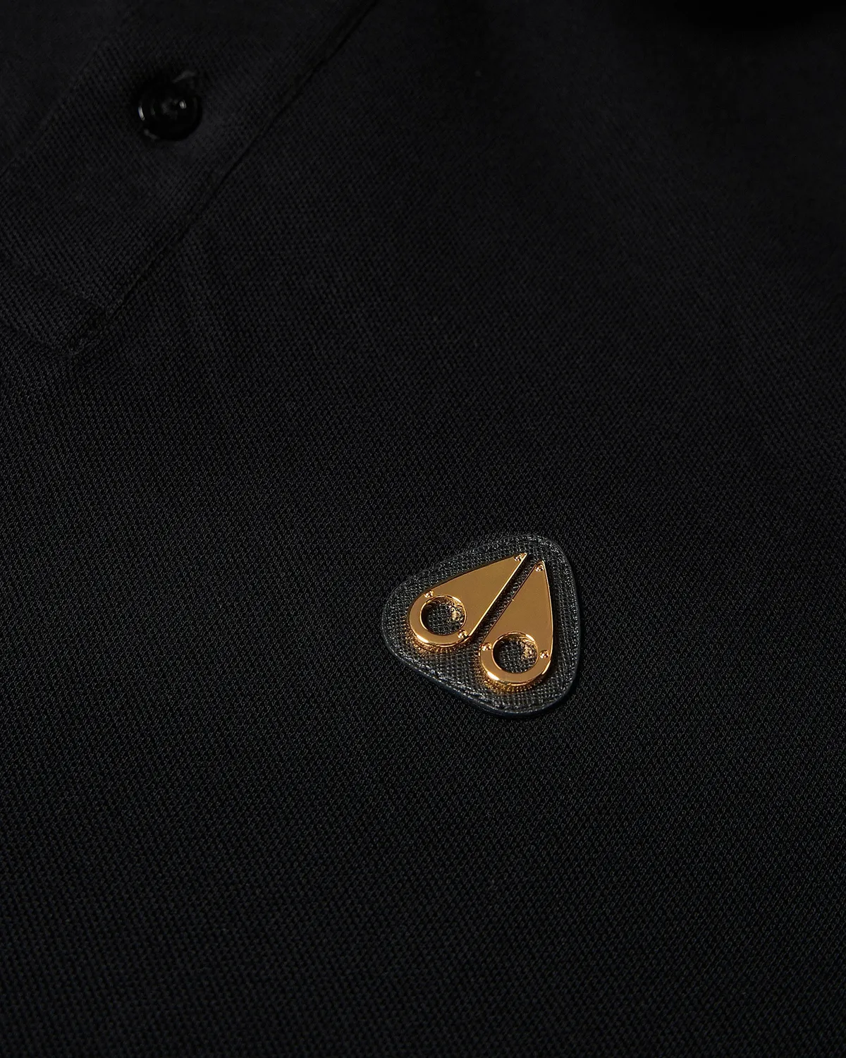 Moose Knuckles Gold Series Everett polo noir détails dorés