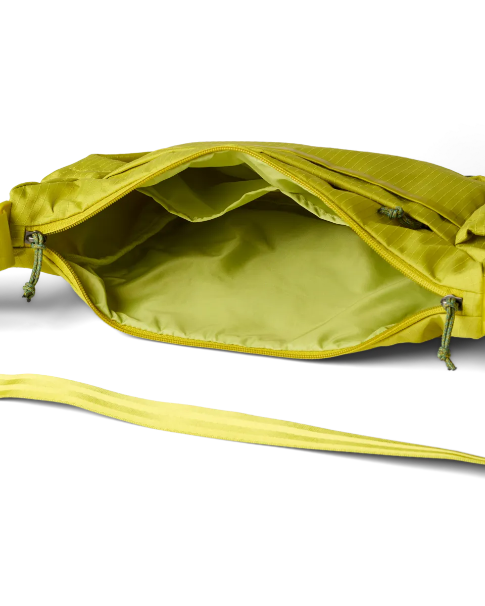 Cotopaxi Viaje sac bandoulière 9L poches gourde